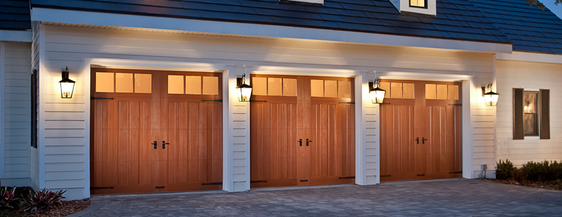 Home with three full width Canyon Ridge Limited Edition Series carriage house garage doors