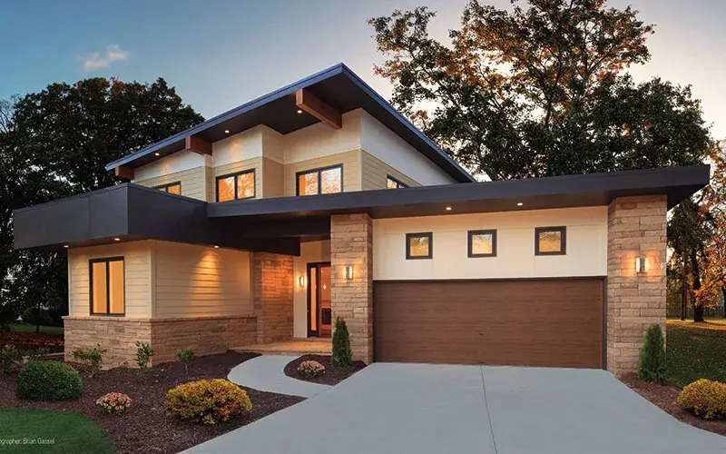 Home with brown Modern Steel Series garage door