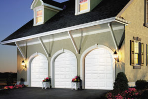 Thumbnail of Home with three white premium series garage doors